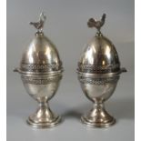 Pair of silver plated novelty egg cups with cockerel or chicken terminals. (2) (B.P. 21% + VAT)