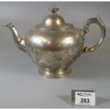 19th Century silver baluster teapot having chased foliate decoration and ivory mounts to the handle.