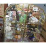 Miniature mirror backed cabinet containing figurines of cats including: an onyx cat, a blue and