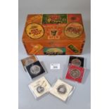 Wooden box with printed brewerania labels, the interior revealing assorted coins to include; 1994