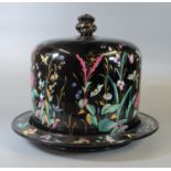 Victorian black ground pottery cheese or stilton bell on stand with cover, hand painted with