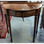 Edwardian style mahogany serpentine front two drawer side table on tapering legs and spade feet. (