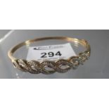 9ct gold diamond set half hoop bangle. Diamond weight 0.25cts in total. Approx weight 9.9 grams. (