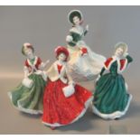 Four Royal Doulton bone china 'Christmas Day' figurines, '1999', '2000', '2001' and '2002'. All in