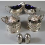 Pair of silver boat shaped two handled salts with Bristol blue glass liners, together with two