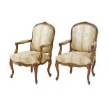 A pair of Louis XV style salon open armchairs