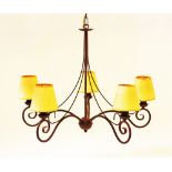 Wrought iron scroll chandelier.