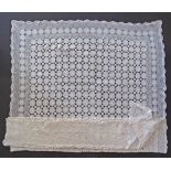 A large white crochet table cloth