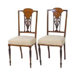 A pair of Sheraton revival mahogany carved and inlaid salon chairs