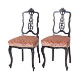 A pair of carved probably French salon chairs