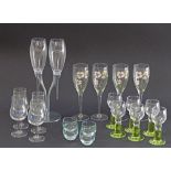 Champagne flutes and other glasses.