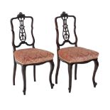 A pair of carved probably French salon chairs