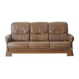 An oak provincial style three seater sofa