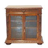 A Flemish / Dutch Renaissance style carved oak display cabinet