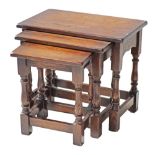 A provincial style nest of oak tables