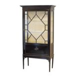 A George III style ebonized astragal glazed library bookcase / display cabinet