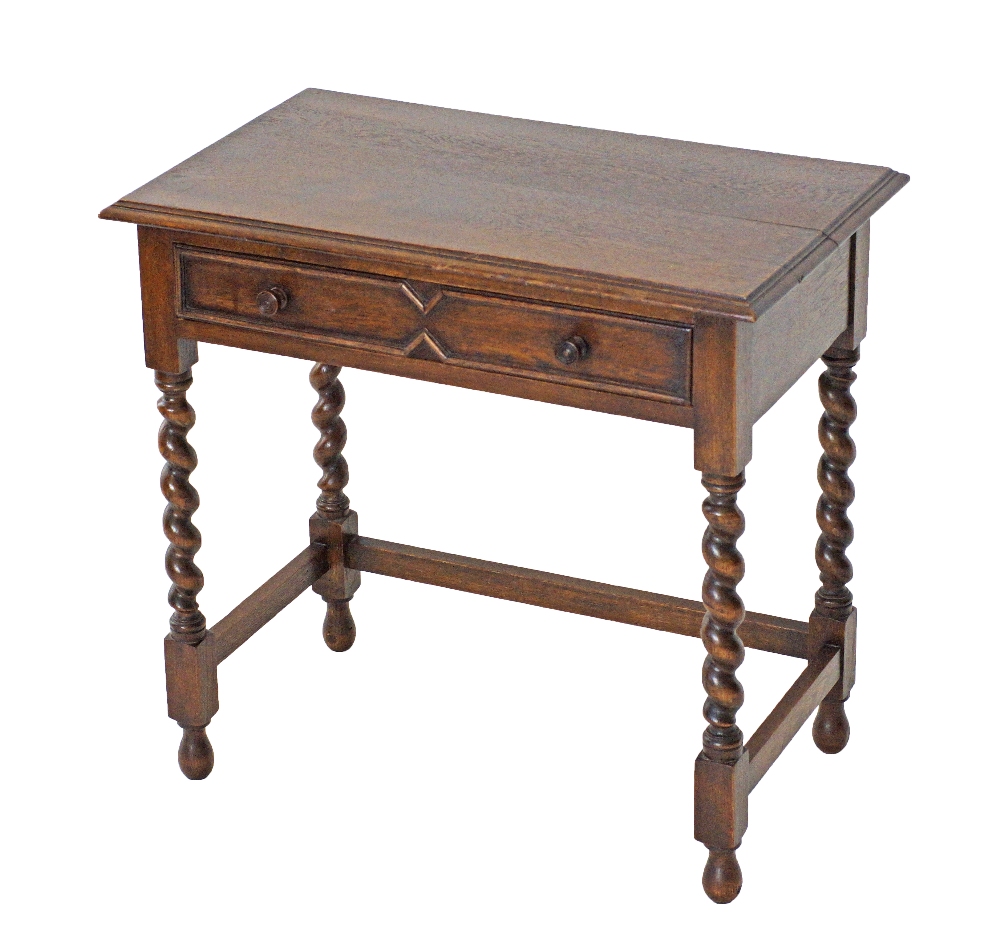 An oak writing table on barley twist legs