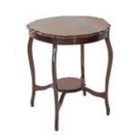 A round serpentine two tier mahogany side table