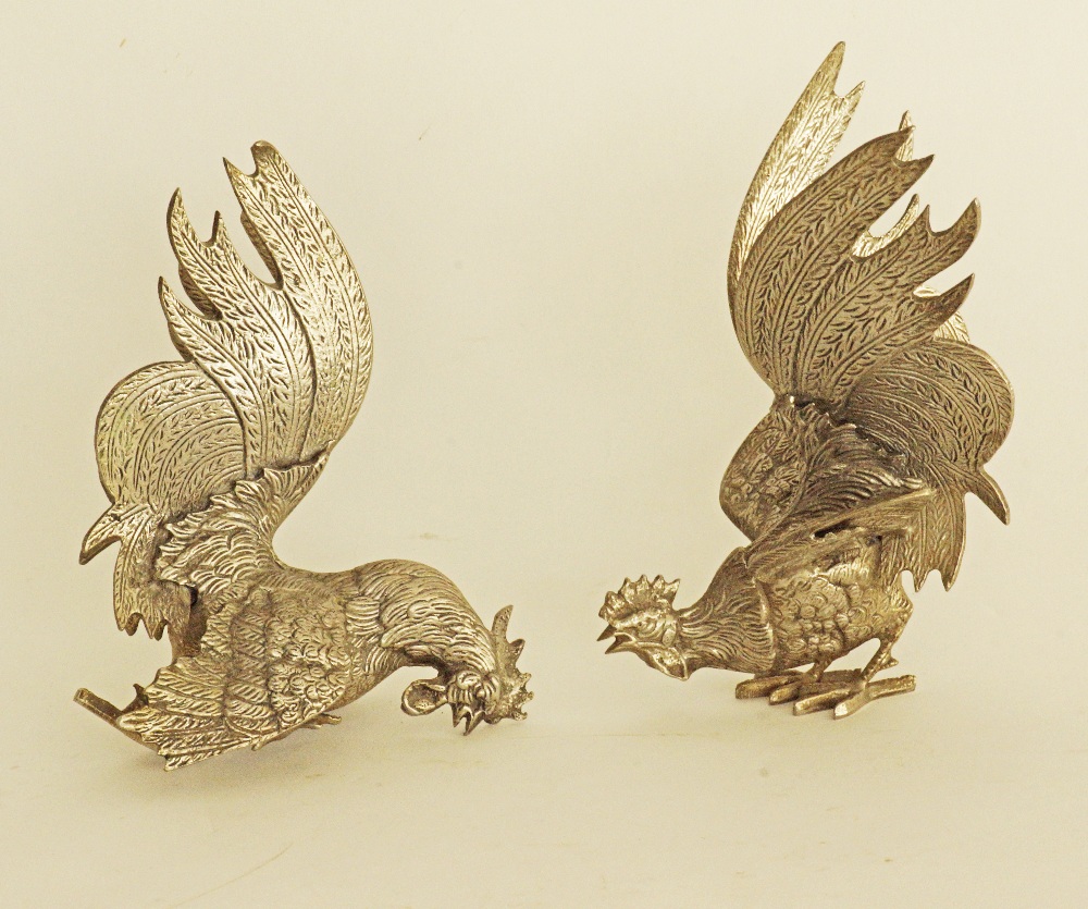 Silver plated fighting cocks / roosters.