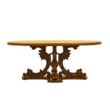 Carved elm Oriental style oval center / library table.