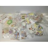 Box of Commonwealth Stamps in Packets - 1500+ Stamps