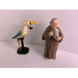 Porcelain Figure of a Monk and Cast Iron Parrot