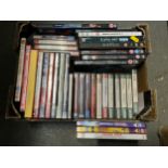 Box of DVDs and Audio Cassette Tapes