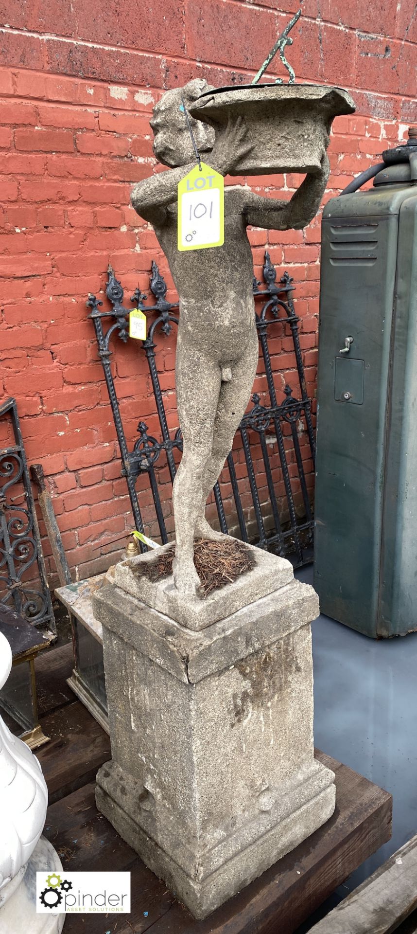 Stone Figure of young boy holding sundial, 890mm tall, on stone base, 540mm tall x 315mm x 315mm,