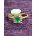 Emerald Ring Set With Brilliant Cut Diamonds Set On Yellow Gold