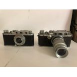 Pair Of Leica's With Lenses