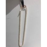 Freshwater single row necklace with clasp in silver with gold 16 inches