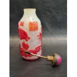 19th/20th century Chinese Carved Coral Colour Glass Snuff Bottle With Mythical Creatures Signed