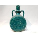 A Ceramic Turquoise Vase with Unique Patterns
