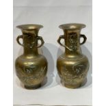 A Pair Of Oriental Engraved Brass Vases