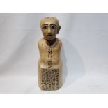 A Wooden Bust of a Pharaoh with One Ear with Hieroglyphics on his Chest and the Base of the Bust