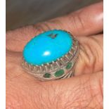 A Solid Silver Persian Turquoise Ring With 6 Emeralds