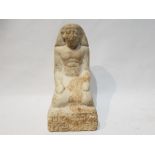 A Stucco Egyptian Pharaoh Figure Kneeling down with hieroglyphs on the Base and on the Back