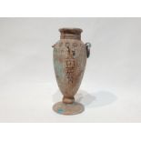 A Marble Vase with Egyptian Hieroglyphics inscribed on it.