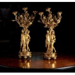 A LARGE PAIR OF 19TH CENTURY FRENCH GILT BRONZE FIGURAL CANDELABRA AFTER THE MODEL BY FALCONET