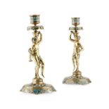 A PAIR OF LATE 19TH CENTURY FRENCH BRONZE AND CHAMPLEVE ENAMEL FIGURAL CANDLESTICKS