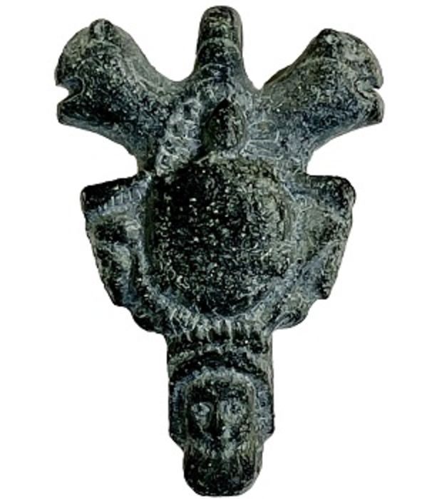 Gray schist stone magical amulet in a form of an pendant with head of a man and mythical animals