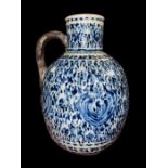 A LARGE RARE BLUE & WHITE DECORATED POTTERY JUG TURKEY, KUTHAYA OTTOMAN 18TH CENTURY