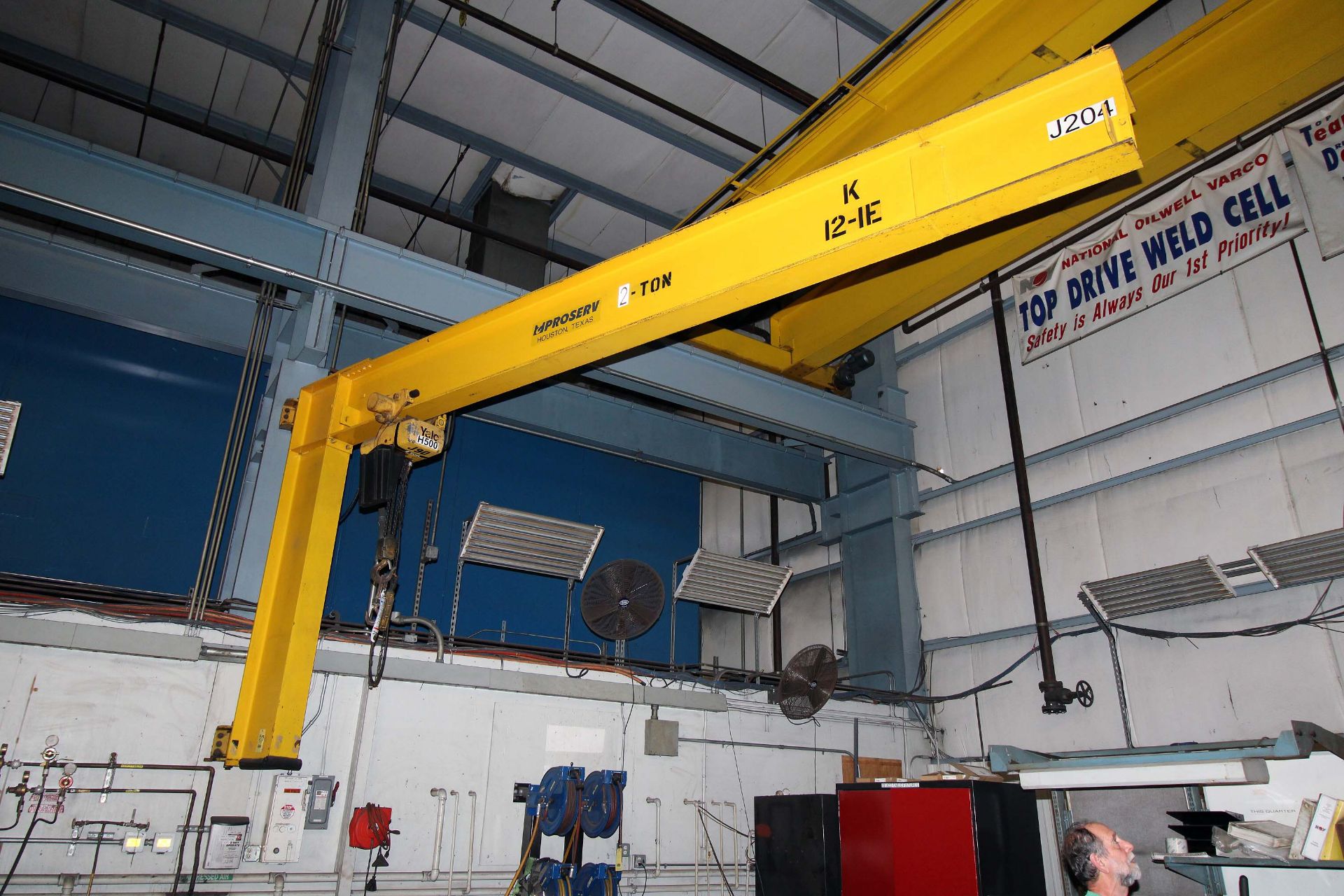 COLUMN MOUNTED JIB CRANE, 2 T. X APPROX. 20' REACH, 14' ht. under hook, Yale 2 T. elec. chain hoist,