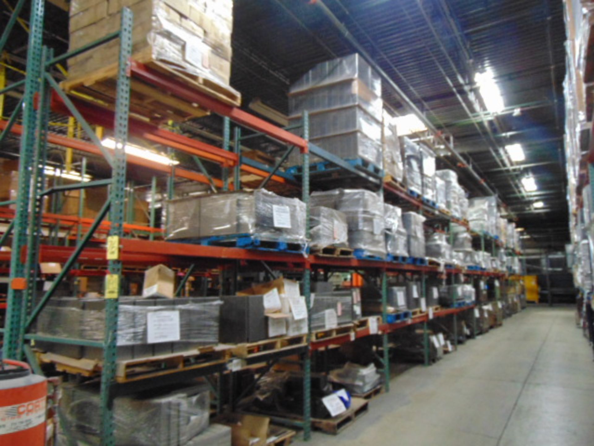 LOT CONTENTS OF PALLET RACKING SECTIONS (24) : assorted steel parts & cardboard (no racks)