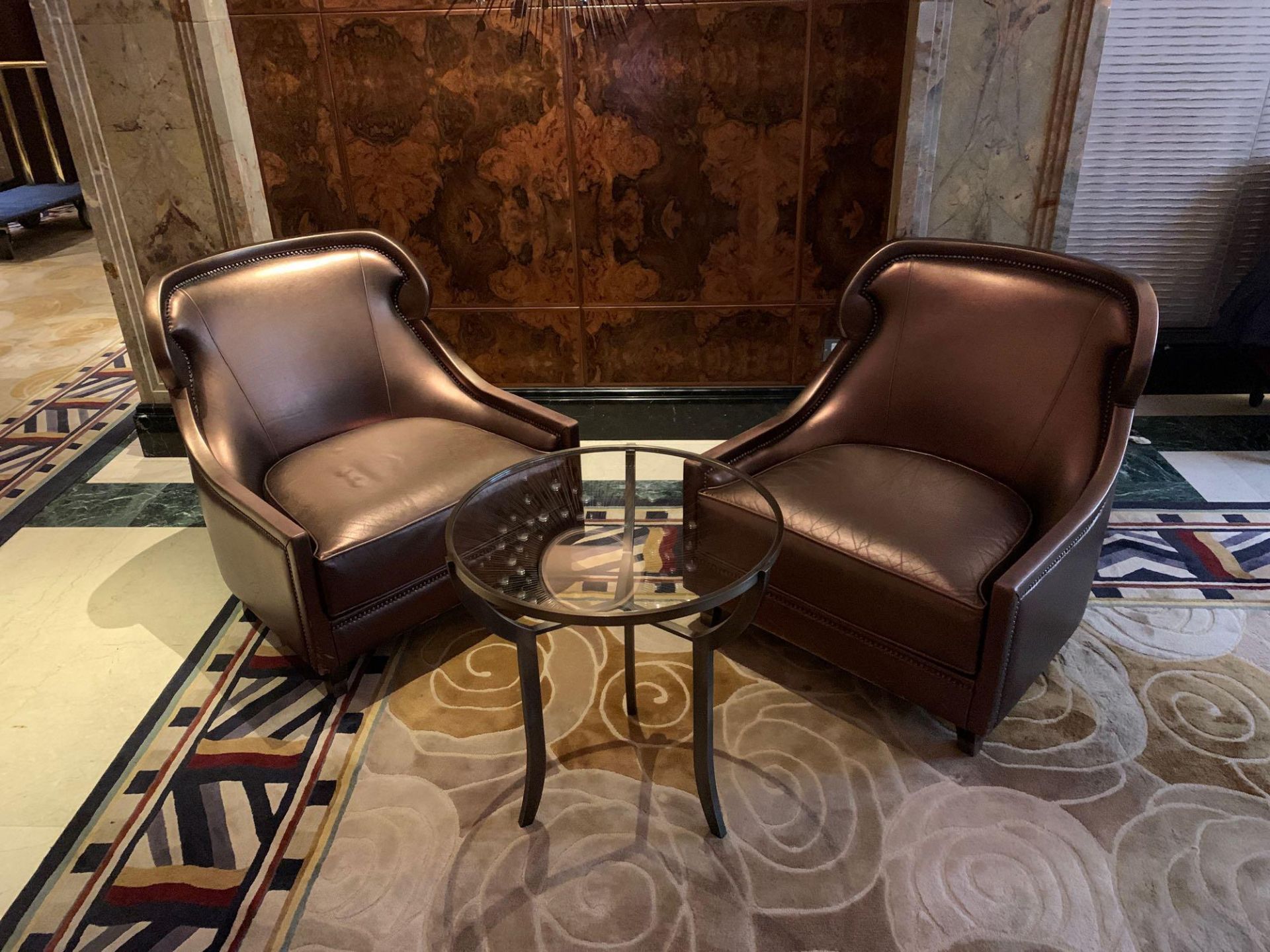 A Pair Of Edelman Lounge Chairs In A Bronze Leathered Upholstery With Studied Pattern. 82x 75x