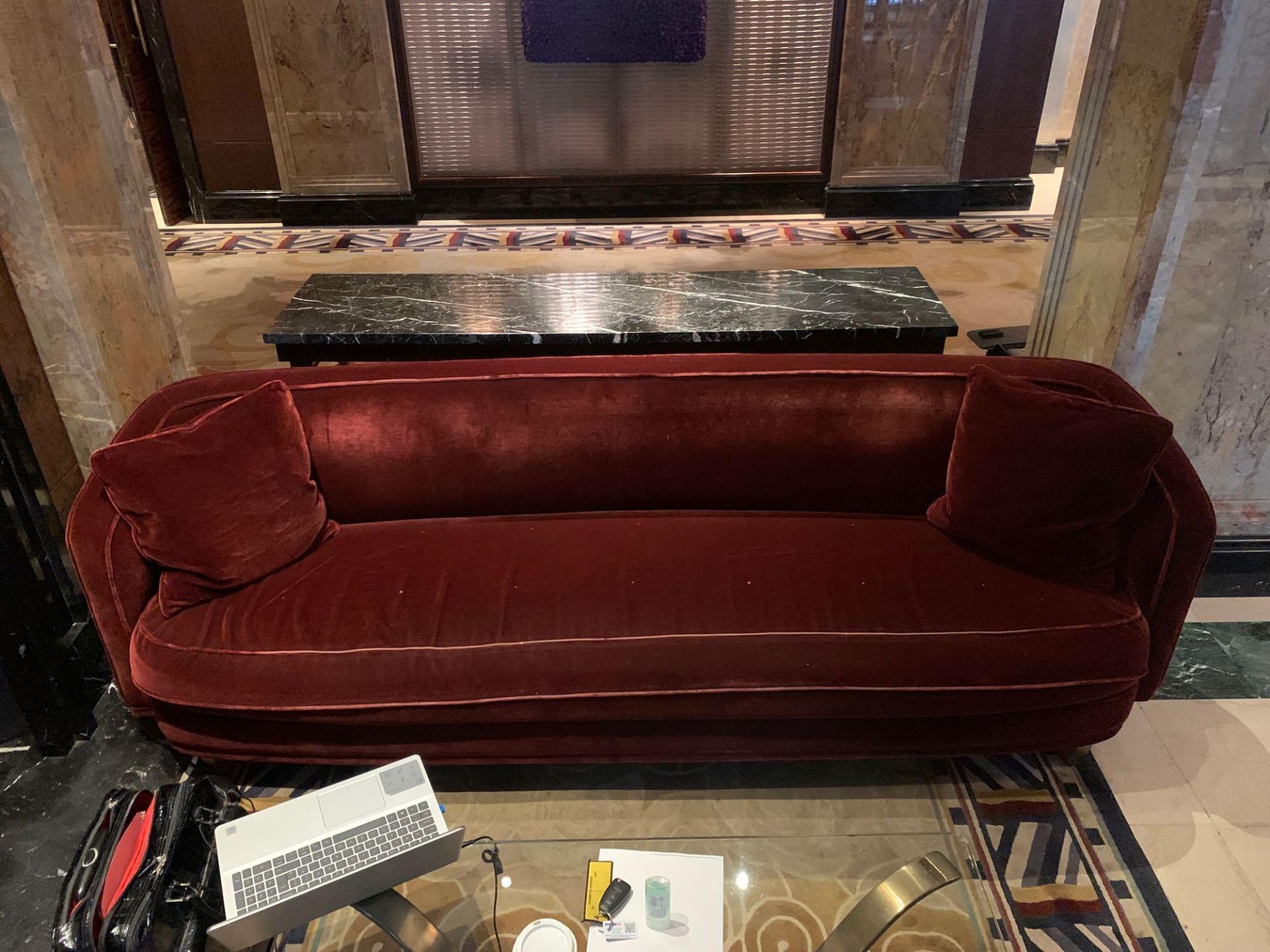 A Curved Arm Red Velvet Sofa 250cm x 80cm With A 63cm Seat Pitch ( Loc Lobby)