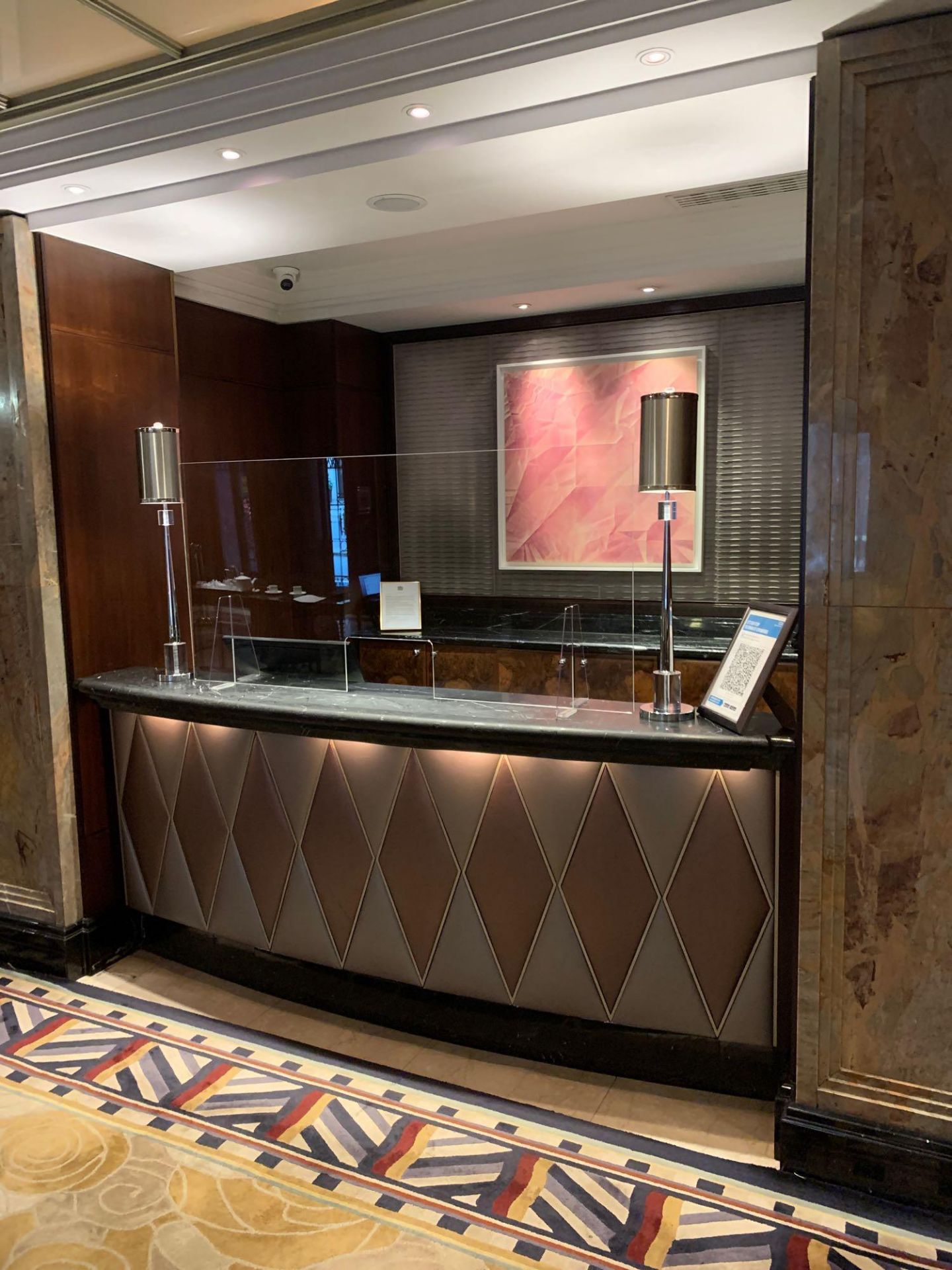 Reception Counter With Black Marble Top And Curved Front Padded Fascia At Front Of Desk 250cm