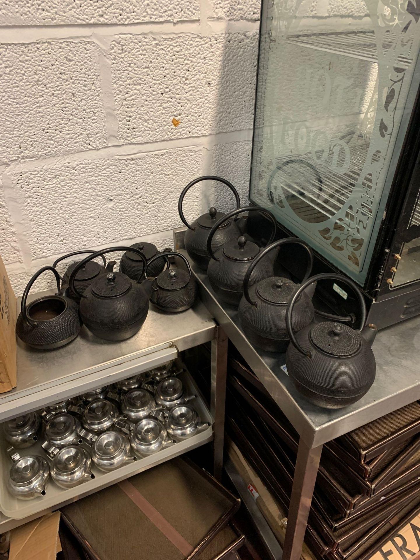 Various black cast iron tea pots (as pictured)