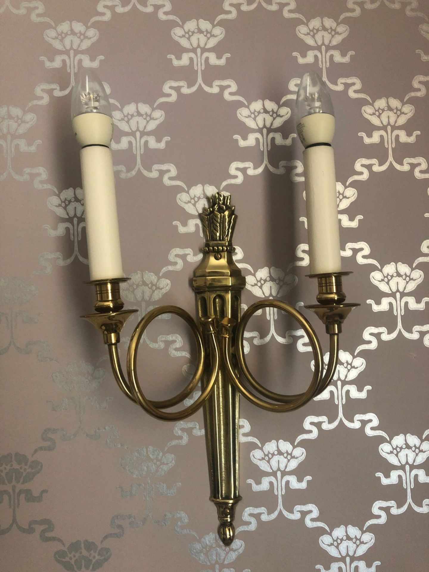 A Pair Of Wall Appliques Twin Arm Capped Scroll Arms Issuing From A Well-Cast Single Decorative