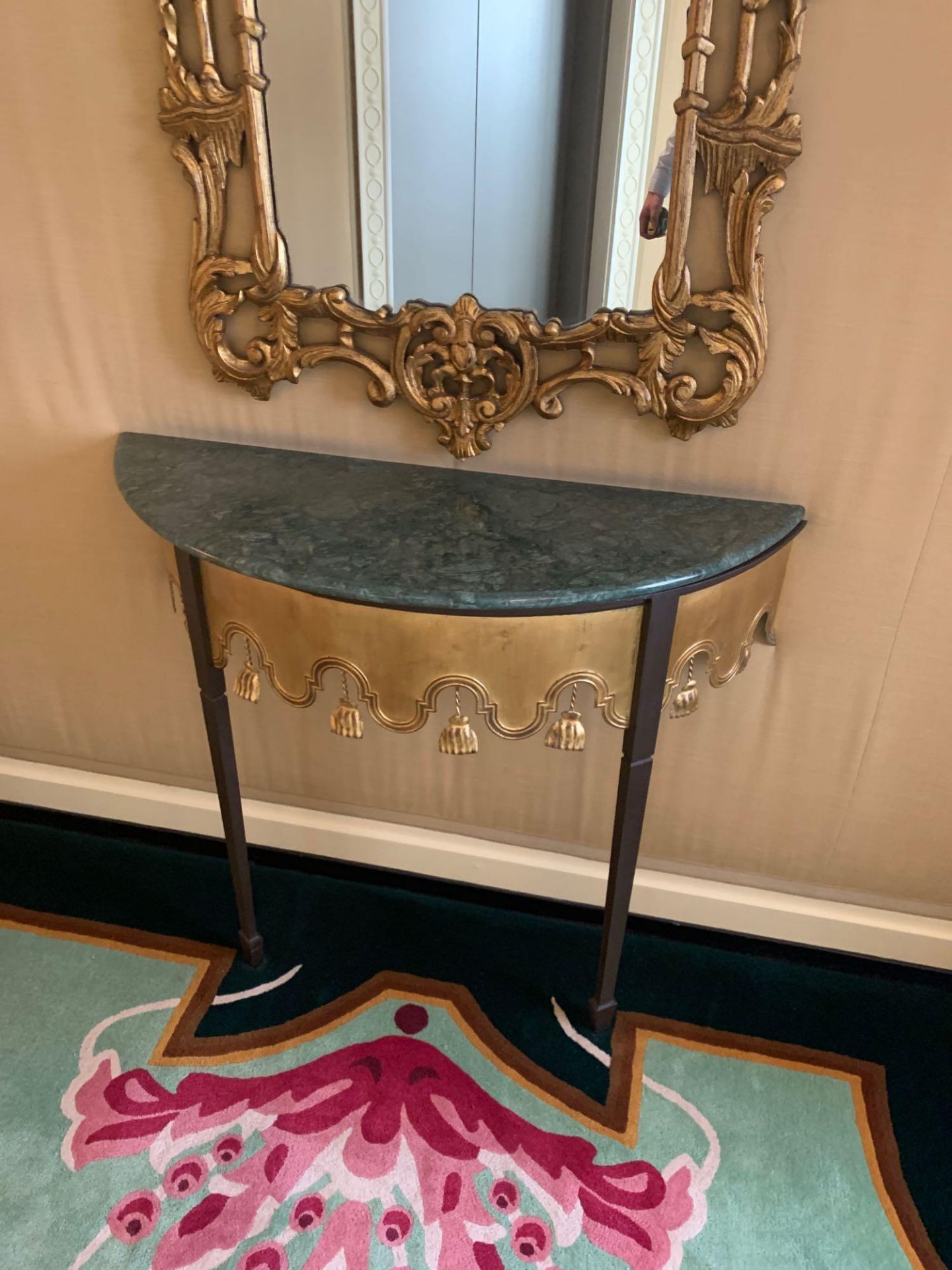 A Wall Mounted Two Legged Console Table The Metal Leg In Antique Bronze With A Detailed Gold Brass